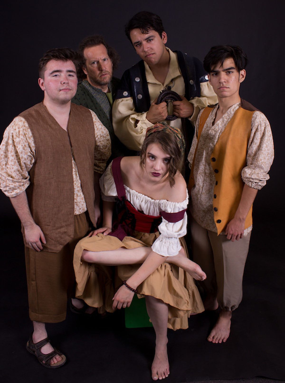 Mikayla Thompson (Aldonza/Dulcinea) surrounded by her tormentors in Ghostlight Theatre Ensemble production of "Man of La Mancha." Back row, from left to right: Justice Krugman (Barber; Muleteer), Kevin Coren (Muleteer), Emilio Lopez (Pedro; Captain of the Inquisition) and Josh Velazquez (Anselmo; Muleteer). The show opens July 13, 2018 at the Theatre at Edna Hill in Brentwood, CA, and runs through July 22, 2018. Tickets are available at www.ghostlightte.org. Mikayla Thompson (Aldonza/Dulcinea) surrounded by her tormentors in Ghostlight Theatre Ensemble production of "Man of La Mancha." Back row, from left to right: Justice Krugman (Barber; Muleteer), Kevin Coren (Muleteer), Emilio Lopez (Pedro; Captain of the Inquisition) and Josh Velazquez (Anselmo; Muleteer). The show opens July 13, 2018 at the Theatre at Edna Hill in Brentwood, CA, and runs through July 22, 2018. Tickets are available at www.ghostlightte.org.