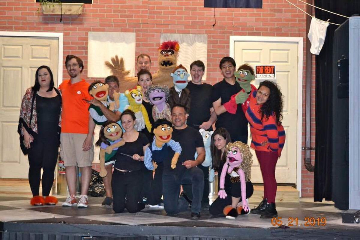 Avenue Q is an American musical in two acts, conceived by Robert Lopez and Jeff Marx, who wrote the music and lyrics. The book was written by Jeff Whitty and the show was directed by Jason Moore. Avenue Q is an "autobiographical and biographical" coming-of-age parable, addressing and satirizing the issues and anxieties associated with entering adulthood. Its characters lament that as children, they were assured by their parents, and by children's television programs such as PBS's Sesame Street, that they were "special" and "could do anything"; but as adults, they have discovered to their surprise and dismay that in the real world their options are limited, and they are no more "special" than anyone else.  The musical is notable for the use of puppets, animated by unconcealed puppeteers, alongside human actors.    Originally conceived as a television series, the show was developed as a stage production at the 2002 National Music Theatre Conference at the Eugene O'Neill Theater Center in Waterford, Connecticut. It opened Off-Broadway in March 2003, co-produced by The New Group and the Vineyard Theatre, and transferred to Broadway in July 2003 where it won three Tony Awards, including Best Musical, and spawned Las Vegas and West End productions, two national tours, and a variety of international productions.    With more than 2,500 performances, Avenue Q ranks 24th on the list of longest running shows in Broadway history. The show ended its Broadway run on September 13, 2009, and then reopened Off-Broadway at New World Stages in October 2009.  Avenue Q celebrated its 15th Anniversary (counting both Broadway and Off-Broadway productions) in July 2018 with a concert in NYC featuring many of the original cast members.