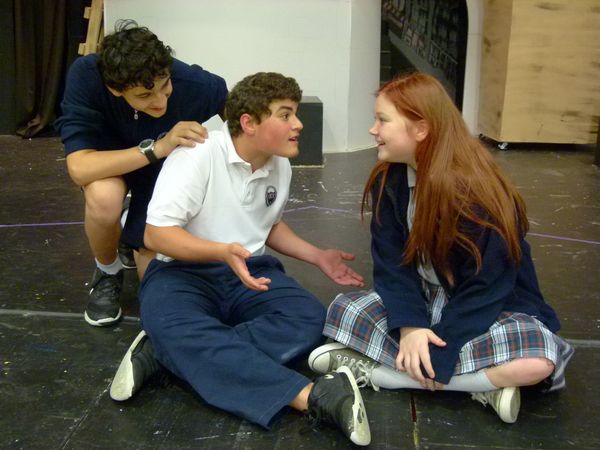 (L to R)
Justin Boackle (7th grader, "Donkey",) C J Romano (8th grader, "Shrek,") and Olivia Fant (8th grader, "Fiona") rehearse a scene from the Our Lady of the Valley Catholic School production of Shrek The Musical JR. 4