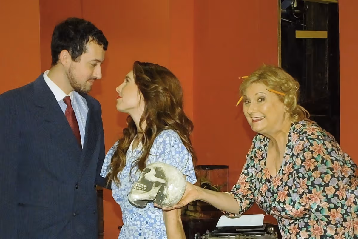 Tony Kirby, Jr. (Andrew Catterall, pictured left) falls for the lovely Alice Sycamore (Carson Delaney, pictured center) to the delight of Penny Sycamore (Sue Chekaway, pictured left) in the delightful Kaufman and Hart comedy, You Can’t Take It With You.
Tony Kirby, Jr. (Andrew Catterall, pictured left) falls for the lovely Alice Sycamore (Carson Delaney, pictured center) to the delight of Penny Sycamore (Sue Chekaway, pictured left) in the delightful Kaufman and Hart comedy, You Can’t Take It With You.