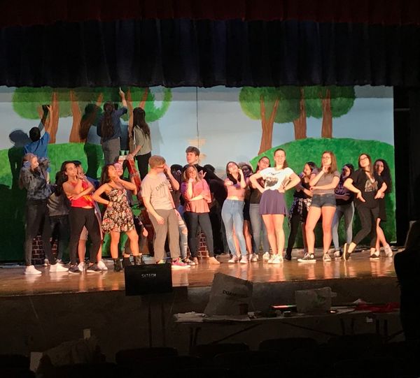 Cast rehearsing a song and dance 2