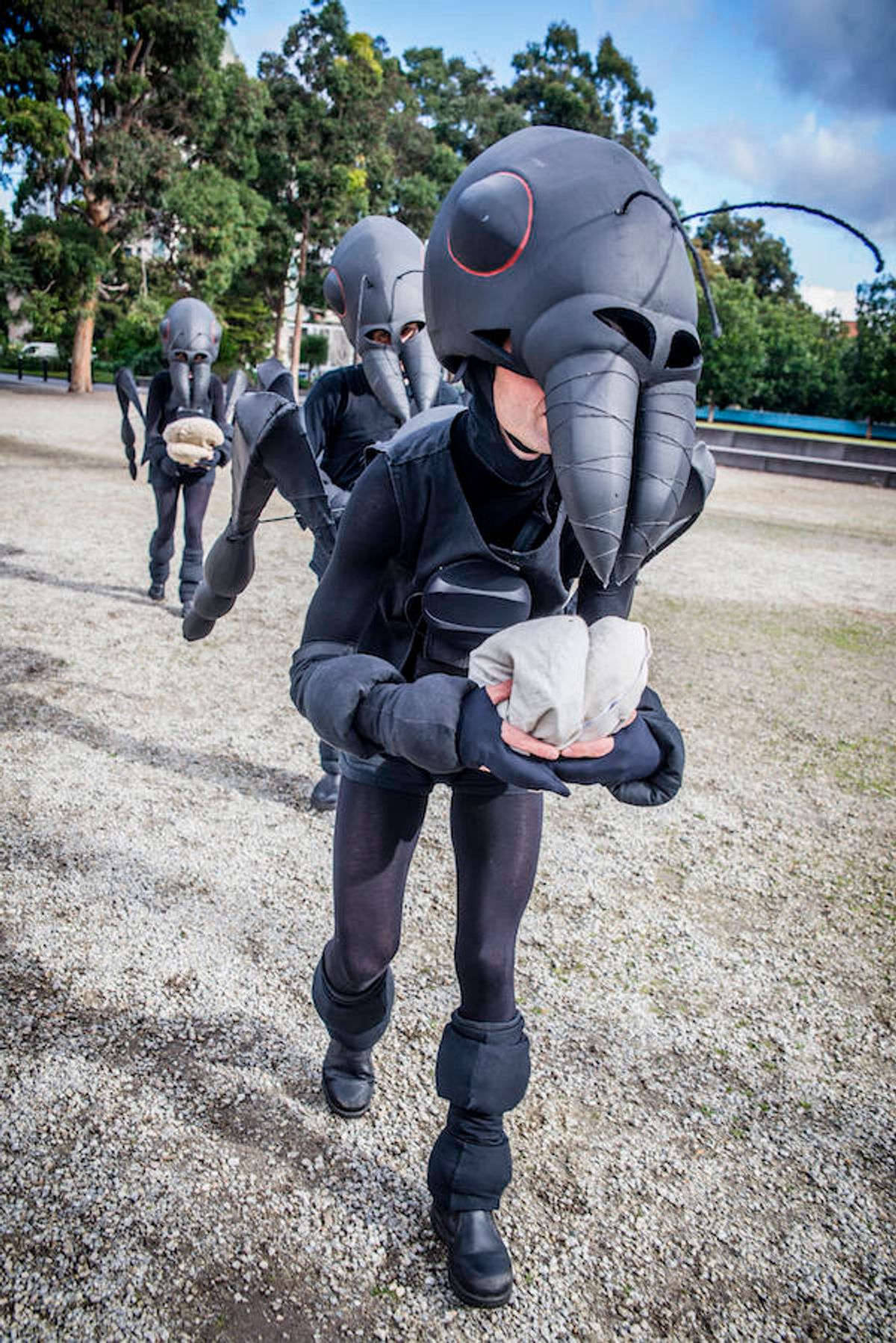 Roving "ants" go about their work as they search for crumbs in this interactive theatre piece for young children