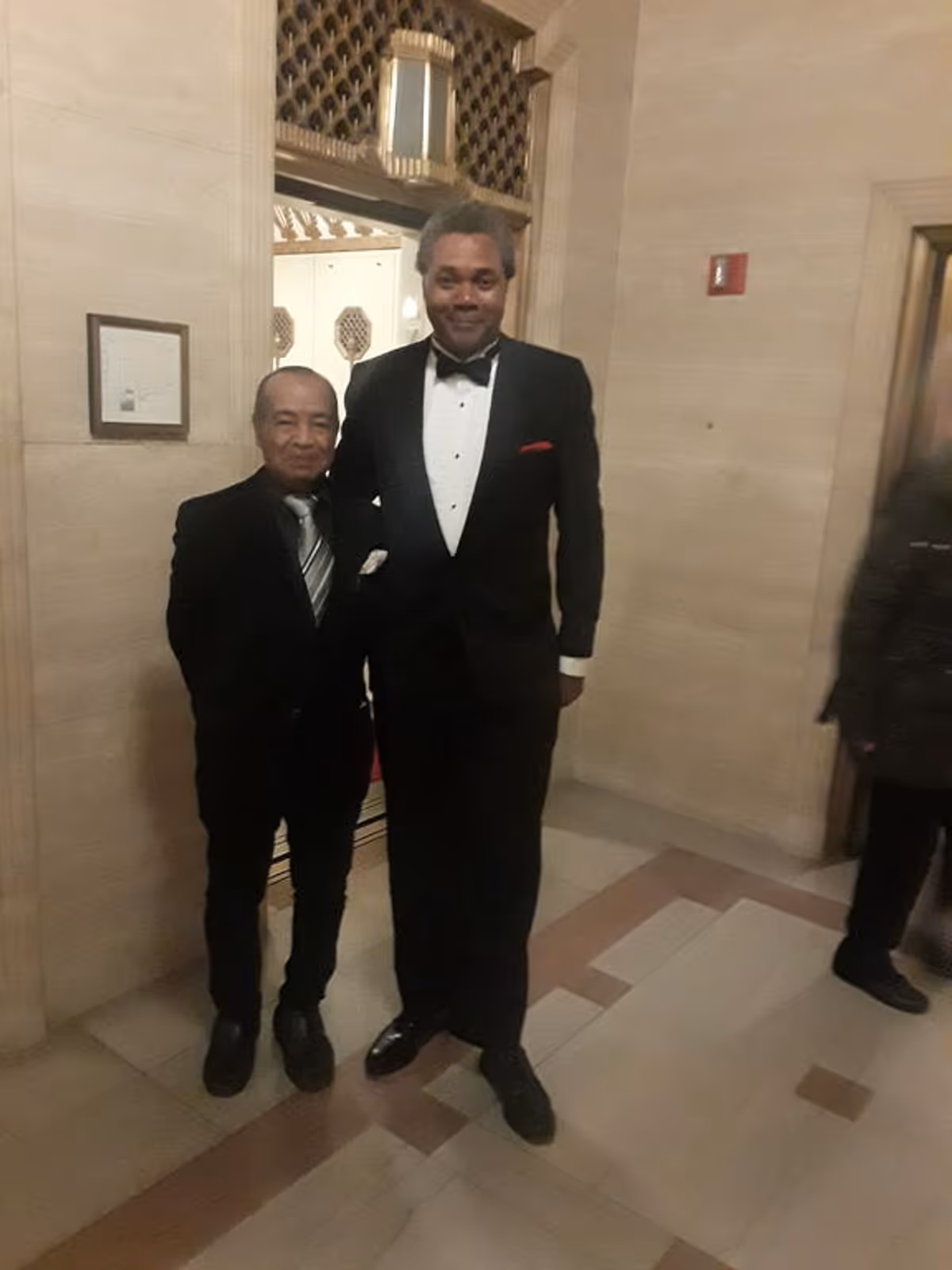 A REUNITED PAIR OF "GODOT" ACTORS!: Posing for a 2019 reunion pic before an elevator at Chicago's historic Lyric Opera House, director and actor Darryl Maximilian Robinson, who appeared as Vladimir, and talented character actor Kim Crawford, who appeared as Pozzo in the 1997 Excaliber Shakespeare Company of Chicago revival staging of Samuel Beckett's "Waiting For Godot" at The Heartland Cafe Studio Theatre in The Windy City.