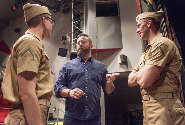Director Richard Roland, center, chatted with actors Johnny Link and Tommy Hart prior to rehearsing a scene from the Penn State Centre Stage production of 'Dogfight' on Mar. 18 at the Penn State Downtown Theatre. Roland is an M.F.A. candidate in the Directing for Musical Theatre program at Penn State.  Image: Patrick Mansell 3