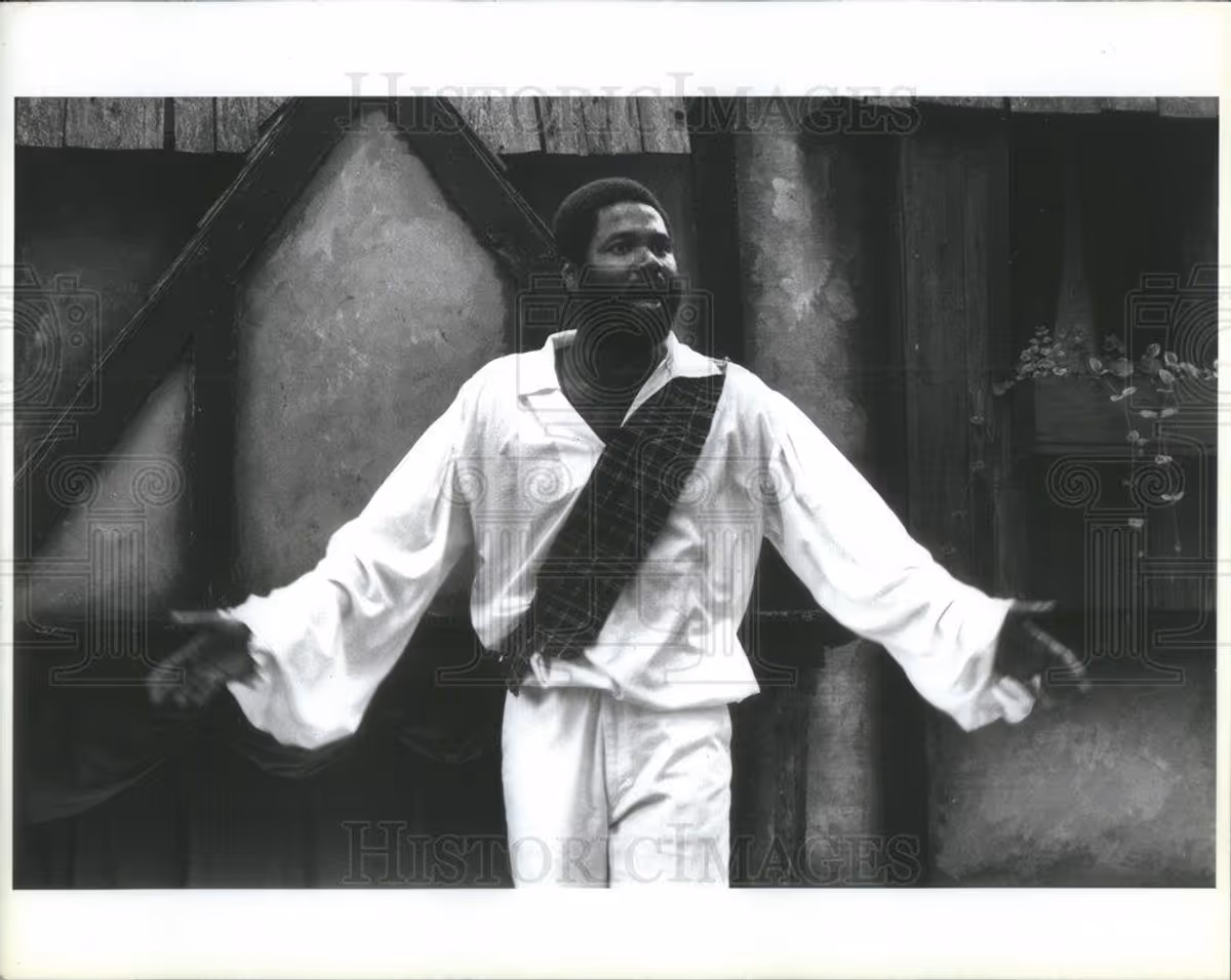 A SOLO SHAKESPEAREAN PERFORMANCE AT A HISTORIC OUTDOOR VENUE: Excaliber Shakespeare Company of Chicago and Excaliber Shakespeare Company Los Angeles Archival Project Founder Darryl Maximilian Robinson stars as Shakespearan actor and time-traveler His Most Revered Lordship, Sir Richard Drury Kemp-Kean in his original one-man show of Shakespeare and time-travel comedy "A Bit of The Bard" upon the outdoor Minstrel's Glen Stage of the 1988 Bristol Renaissance Faire in Kenosha, Wisconsin. Photo by Robert Levy.