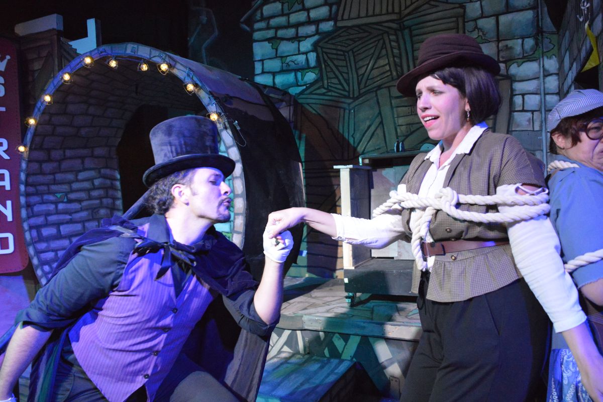 Sean Blocker as Ian Sideous attempts to woo Jess Neptune as Dixie Troobaloo (to the horror of Diana Rodriguez''s Guillermo Fao), in The Garage Theatre''s production of The Steam-Powered Rocket Ride to T