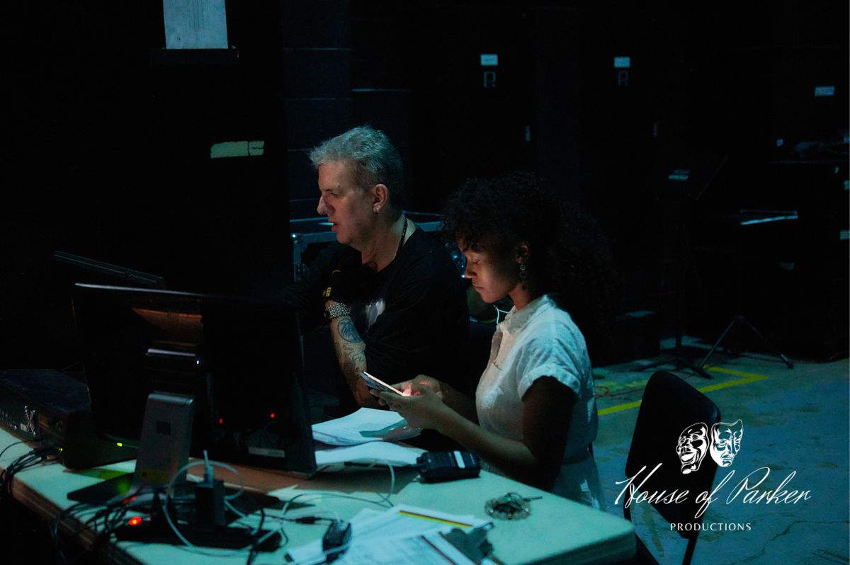 The stage environment comes together through intentional coordination of lighting and sound, with Desiree Parker working closely across departments to shape the production?s atmosphere. The stage environment comes together through intentional coordination of lighting and sound, with Desiree Parker working closely across departments to shape the production?s atmosphere.