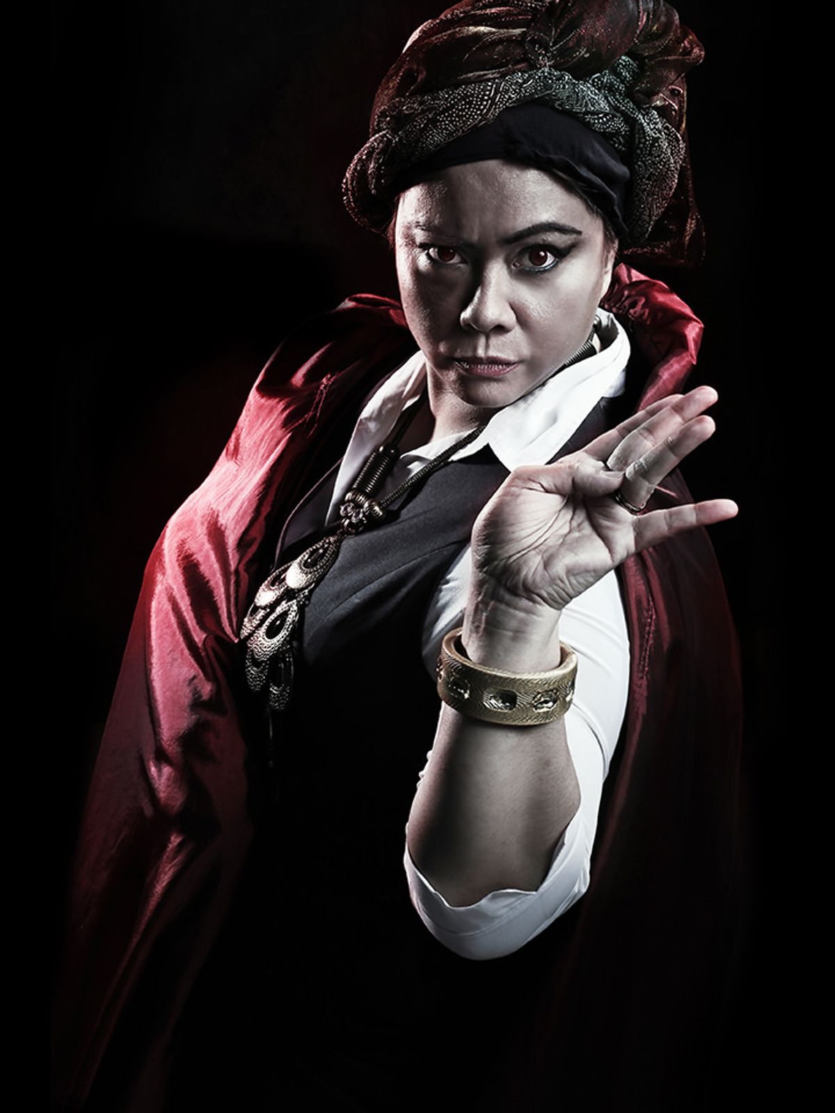 Tina Isaacs as Aini the Bomoh