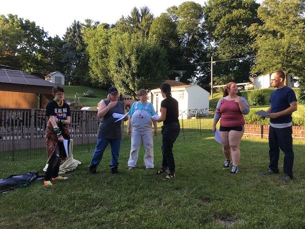 Titania and Oberon arguing, while Puck and the Fairy Court look on. 2