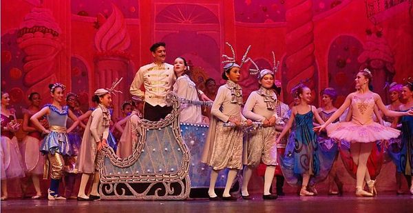 Edward R. Cox as Uncle Drosselmayer performs magic to entertain the Party Children. 6