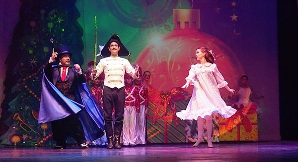 Edward R. Cox as Uncle Drosselmayer performs magic to entertain the Party Children. 8