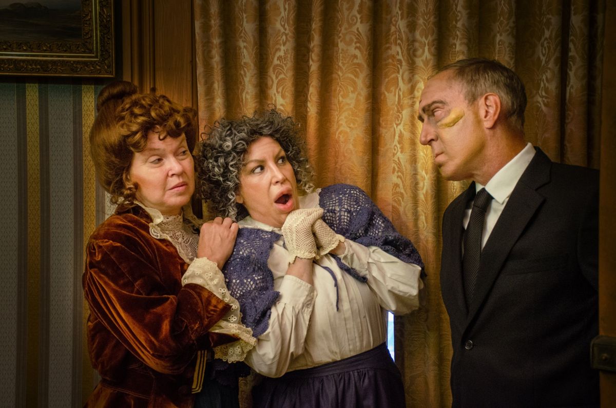 Jonathan (Steve Larson) pays an unwelcoming surprise visit to his Aunts Martha (Joyce McGookey, left) and Abby (Andrea Krass McDonald, right) in Village Player's Production of Arsenic and Old Lace. (Photo credit: Joseph Lease) Jonathan (Steve Larson) pays an unwelcoming surprise visit to his Aunts Martha (Joyce McGookey, left) and Abby (Andrea Krass McDonald, right) in Village Player's Production of Arsenic and Old Lace. (Photo credit: Joseph Lease)