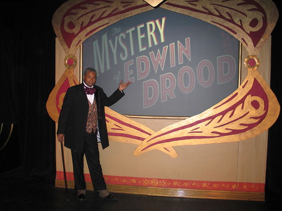 No Joke, It Really Is A Bit Of A Mystery: 2019 Broadwayworld Chicago Award nominee for Best Performer In A Musical or Revue Darryl Maximilian Robinson as The Chairman Mr. William Cartwright and Mayor Thomas Sapsea takes pains to keep the audience in good humor and always guessing what's next in the 2018 Saint Sebastian Players of Chicago Revival of Rupert Holmes' 'The Mystery of Edwin Drood'. Photo by Emil Zbella. No Joke, It Really Is A Bit Of A Mystery: 2019 Broadwayworld Chicago Award nominee for Best Performer In A Musical or Revue Darryl Maximilian Robinson as The Chairman Mr. William Cartwright and Mayor Thomas Sapsea takes pains to keep the audience in good humor and always guessing what's next in the 2018 Saint Sebastian Players of Chicago Revival of Rupert Holmes' 'The Mystery of Edwin Drood'. Photo by Emil Zbella.