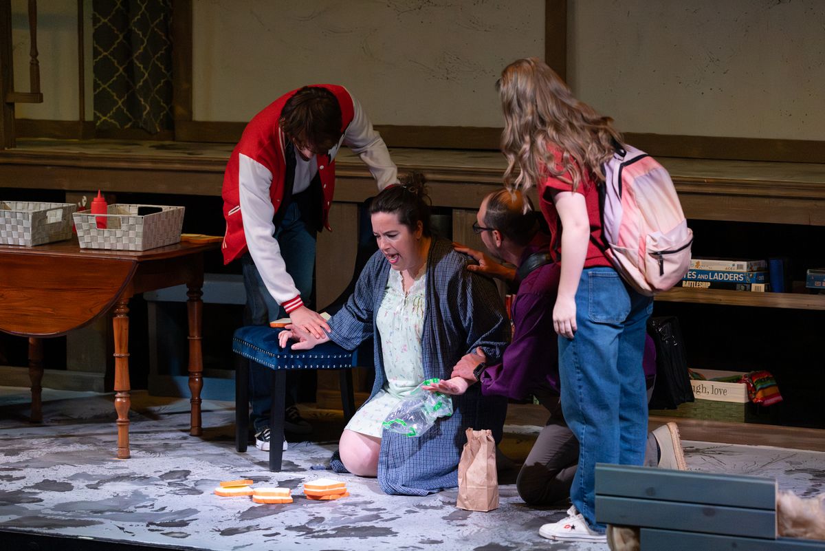 Diana (Heather Clark) making sandwiches on the floor.