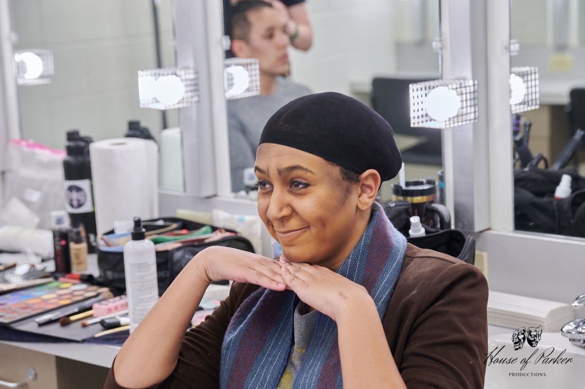 Tatiana Lee in hair and makeup as the homeless woman, undergoing transformation as she prepares to embody the character on stage. Tatiana Lee in hair and makeup as the homeless woman, undergoing transformation as she prepares to embody the character on stage.
