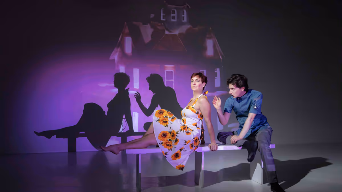 Sabra Shelly and Aaron Greenberg in WE. Costume Design by Alyssa Korol. Projection Design by Matthew Deinhart. Photo by Jonathan Levin.