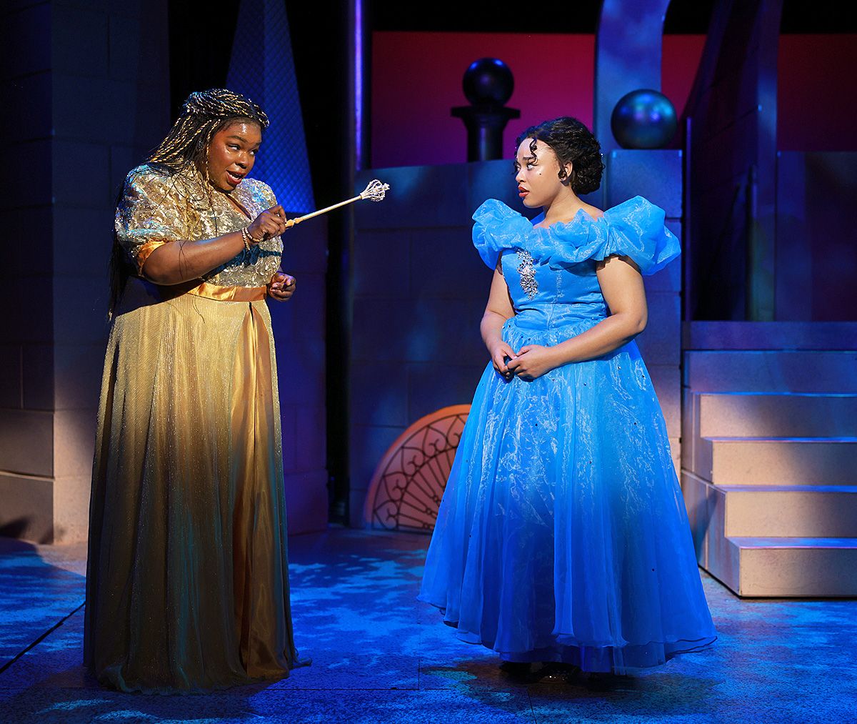 Her Fairy Godmother (Chanel Edwards-Frederick), left, warns Cinderella (Grace Ellis Solomon) to leave the Prince's ball by midnight in Rodgers & Hammerstein's Cinderella, now on stage through July 12. Her Fairy Godmother (Chanel Edwards-Frederick), left, warns Cinderella (Grace Ellis Solomon) to leave the Prince's ball by midnight in Rodgers & Hammerstein's Cinderella, now on stage through July 12.
