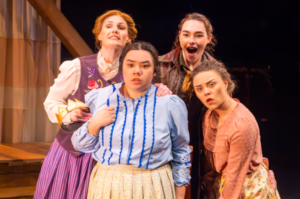 Meg, Beth, Jo, and Amy March spot Laurie from their attic window for the first time (l-r: Amy Rene Byrne, Kimie Muroya, Mackenzie Moyer, and Arrianna Daniels). Photo by Kyle Huggins.  1