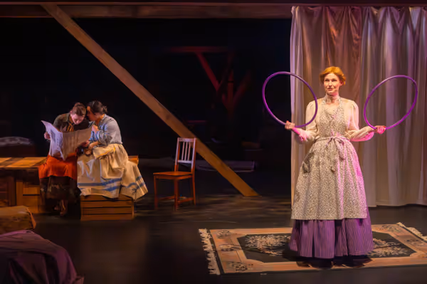 While Jo and Beth discuss the reviews of Jo   s novel, miles away, Meg struggles to make current jam in her new home (l-r: Mackenzie Moyer, Kimie Muroya, and Amy Rene Byrne). Photo by Kyle Huggins. 19