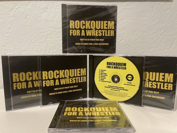 Ton-Up, Inc. is proud to announce the release of a live cast recording from the Rock-n-Roll Wrestling Spectacle, “Rockquiem For A Wrestler.” *The CD of a Live Cast Recording containing eight songs from the show, recorded at New York’s Triad Theater on June 27, 2020, was released on January 7, 2022. 1