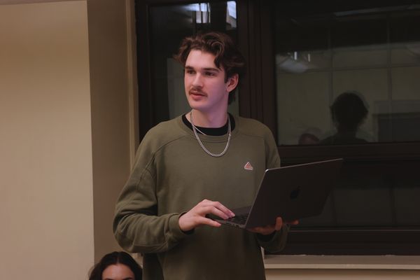 Connor Spaulding (Playwright) watches actors Diego Tobar (Carson) and Matt Hekking (Maxwell) act out a scene from the reading. 4