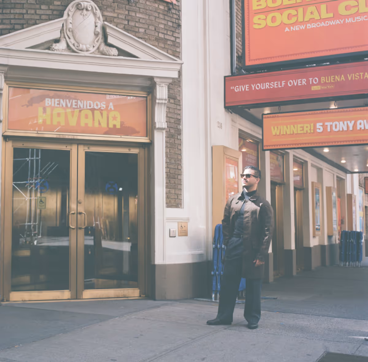 Jesus Pupo beside the Young Ruben character poster outside the Gerald Schoenfeld… Photo
