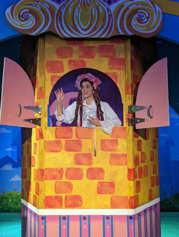 Eric (Stephen Denning) and Mary (Maria Hefte) share a light hearted moment with their daughter Rapunzel (Kelly Laines) 5