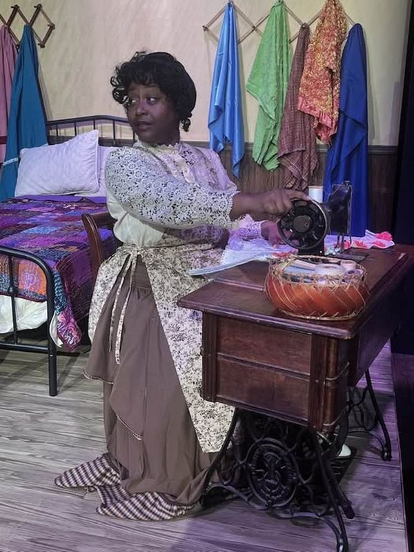 Esther (Nakeisha McGee) is stitching away on INTIMATE APPAREL for a client in the opener for Season 42 at Carpenter Square. 1