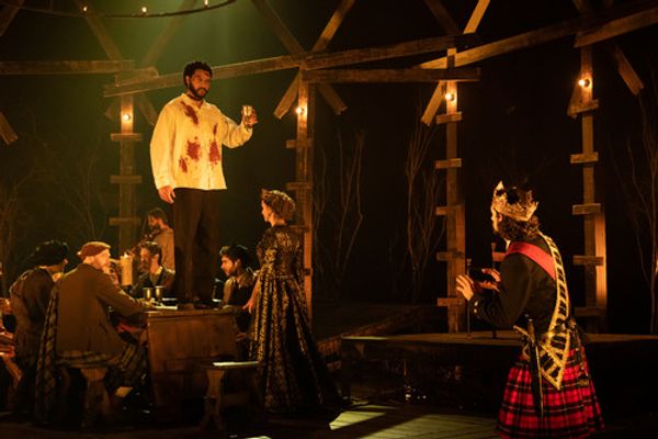 Macbeth (Benjamin Bonenfant) sees the ghost of Banquo (Cordell Cole) after Macbeth gives the order for him to be murdered. Members of the banquet (including Meghan Andrews as Lady Macbeth) do not see the apparition and look on in confusion. Photo by Hillary Taylor for Alabama Shakespeare Festival. 1