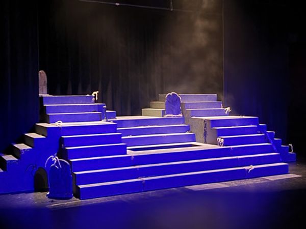 The set combining the Midwestern set cemetery of Spoon River with a Greek style of storytelling. 1