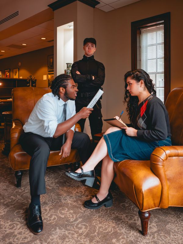 (L to R): Trevor Hudson (Calvin), Jonah Uffelman (Nikolas/The Guard), and Victoria Martinez (Ensemble/Swing) for Antigone 1989: A Town Hall Musical. Photo by Geovanny Soto. 6