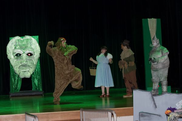 The lion (Alex Stansbery) runs form the Wizard of Oz 17