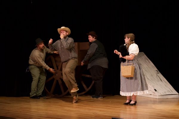 Dorothy (Emma Henderson) and farm staff Hunk (Joey Powell), Hickory (Korben McLain), and Zeke (Alex Stansbery) 2