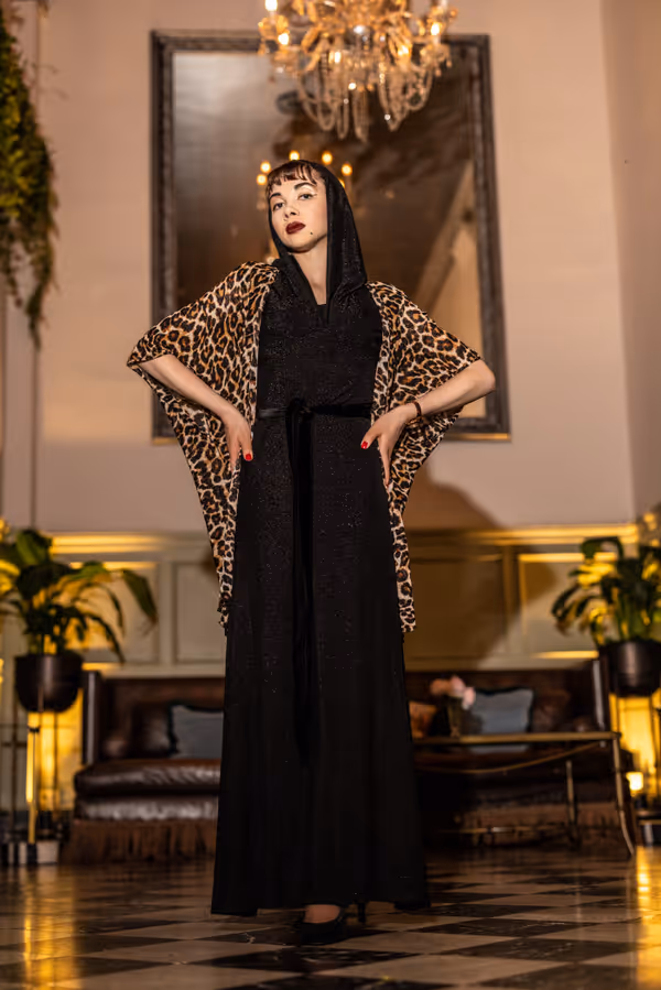 Tiffany Brannan as Norma Desmond, the silent movie star. 6