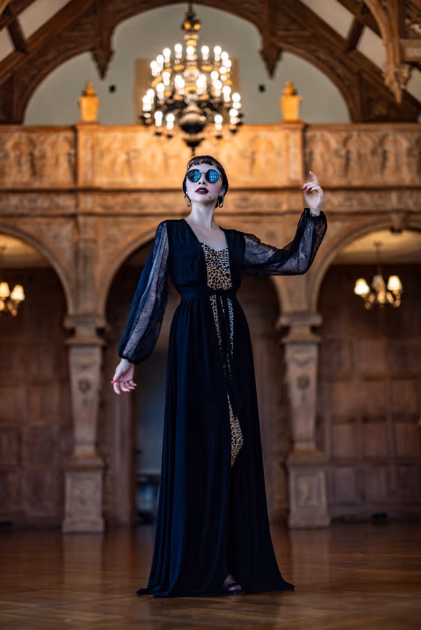 Tiffany Brannan as Norma Desmond, the queen of silent films. 7