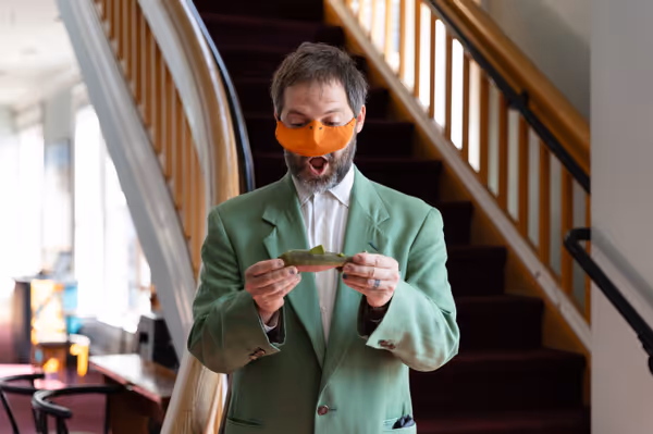 Nate Speckman plays Mr. Duck, the American delegate who always gets his fish in Heart of Duckness by A.J. Ditty. Photo by Hannah Daly Ellsworth. 7