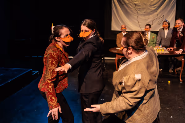 King Leopold II (Allison McCall, left) tries to fight the Marquês de Penaquill (Hollie Pryor, right) but Sir Mallard (Madison Shmalo) gets in the way as the other delegates look on in Heart of Duckness by A.J. Ditty. Photo by Kat Moraros Photography. 9