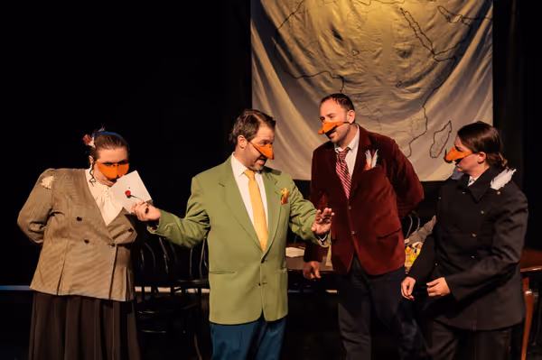 “All’s fair in love and politics,” including a little blackmail according to Mr. Duck (Nate Speckman, center left) which impresses the Marquês de Penaquill (Hollie Pryor, left) and irritates Baron de Crested (Ryland Garnett, center right) and Sir Mallard (Madison Shmalo, right) in Heart of Duckness by A.J. Ditty. Photo by Kat Moraros Photography. 10