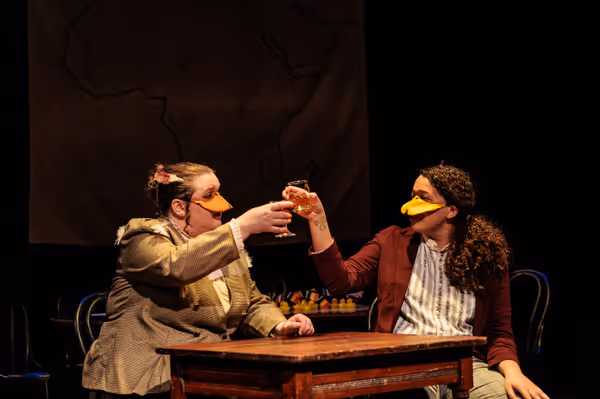 The Marquês de Penaquill (Hollie Pryor) and Kivadangu (Maya Williams) toast to Penaquill’s mad mission in Heart of Duckness by A.J. Ditty. Photo by Kat Moraros Photography. 16