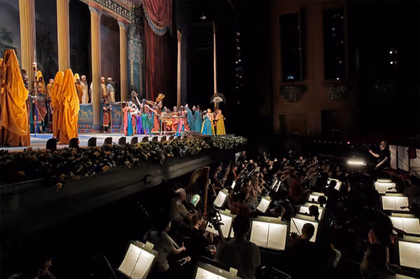 A scene from LA Opera's 2017 production of Nabucco. Shown: conductor James Conlon in the orchestra pit. (Photo: Ken Howard) 4