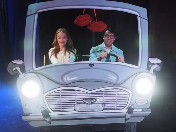 Brad (David Livingston) is an excellent driver. Just ask Janet (Maeve Lowney) 8