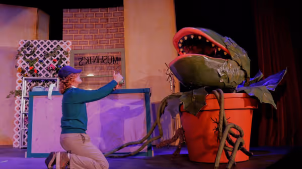 Seymour (played by Kadin Henige) and Audrey II 6