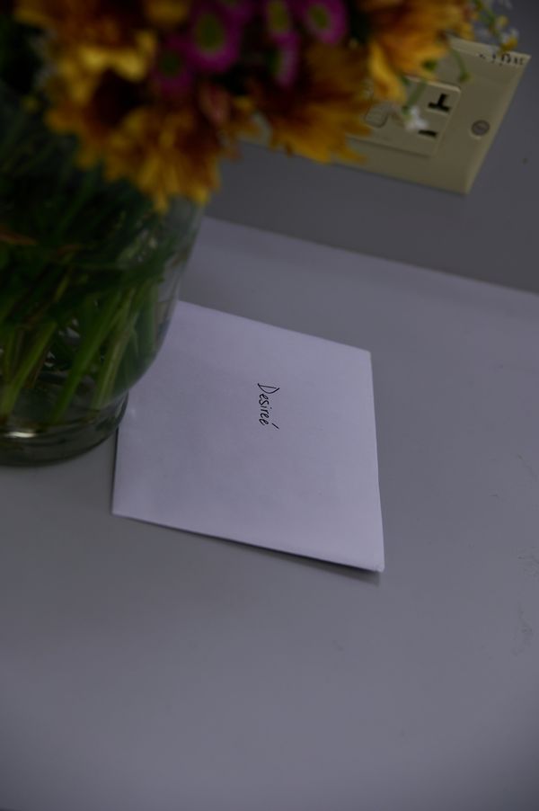Flowers and a handwritten note addressed to Desiree Parker before the show, marking the debut of her first written play, Miles of Grace, at the Herberger Theater Center, a highly respected performing  13