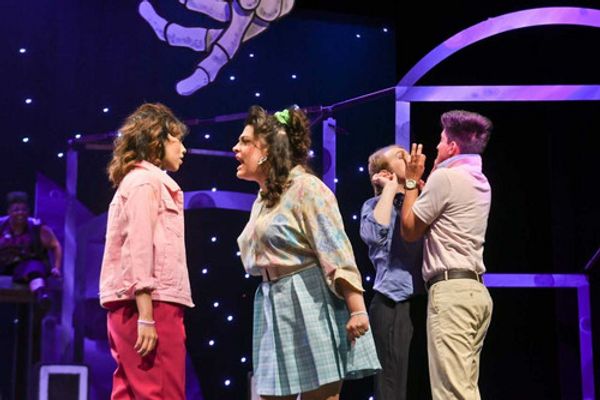 Helena (Micah Wolfe) accuses Hermia(Dani Gonzales) of conspiring with Lysander (Michael Reyna) and Demetrius (Sean Wilson) to make fun of her by pretending to love her, while Puck (Angela Flores) looks on with amusement!
Photo Credit: Al Caballero 1