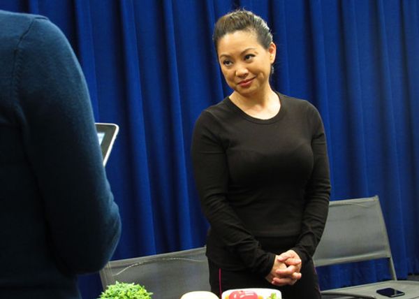 Director Elina de Santos giving a presentation at the Design Preview Party for 