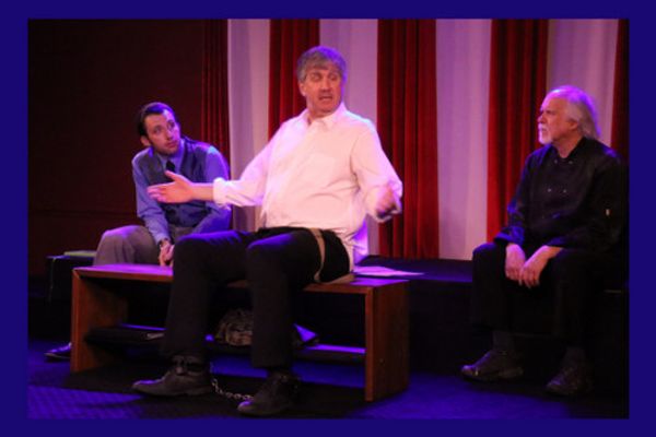 An imprisoned Socrates converses with Phaedo and a guard 1