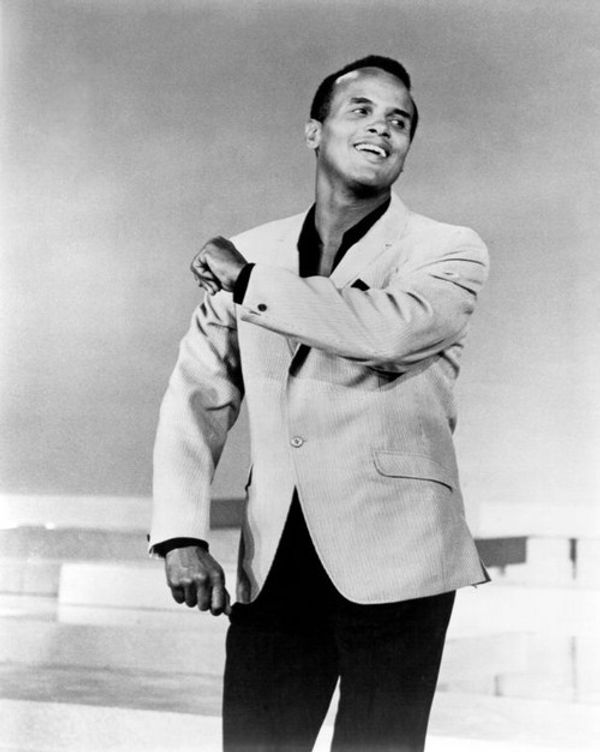 AMERICA'S FIRST AFRICAN-AMERICAN MALE PERFORMER TO WIN THE EMMY!: Here is the legendary star Harry Belafonte with his 1960 Emmy Award as Outstanding Performer for his 1959 television music special 