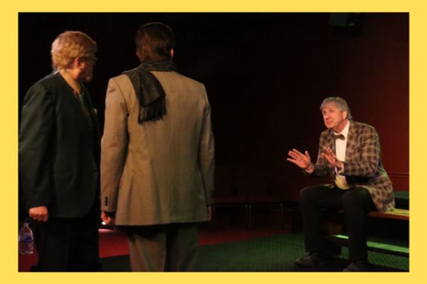 An imprisoned Socrates converses with Phaedo and a guard 3