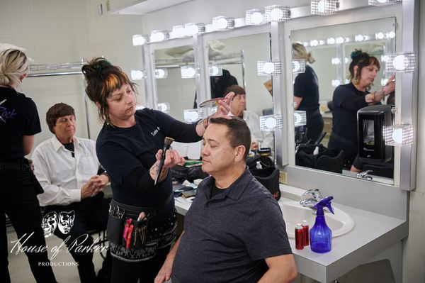 Joe Paul Garcia and Rick Howard in hair and makeup, highlighting the level of care, precision, and professional artistry dedicated to shaping each character before they take the stage. 9