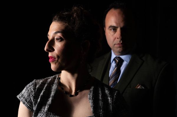Tony (George Psarras, member, Actors' Equity Association) suspects that his wife is stepping out on him with Maxine (Maria Marquis) in Dial M for Murder. Photo by Christian Pizzirani. 2